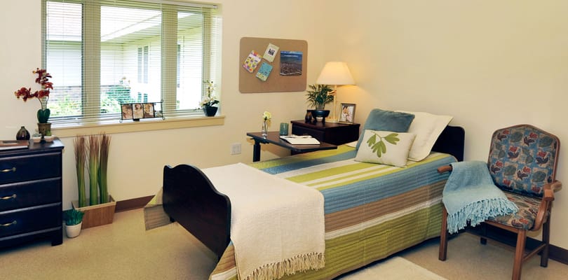 Cozy resident room with a bed and natural light