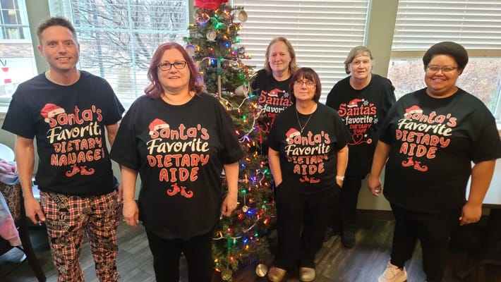 Staff celebrating the holidays in themed shirts