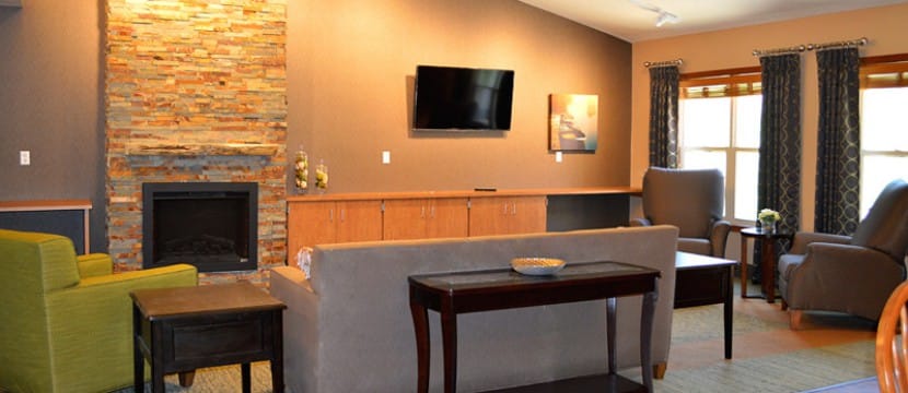 Common area with comfortable seating and a fireplace