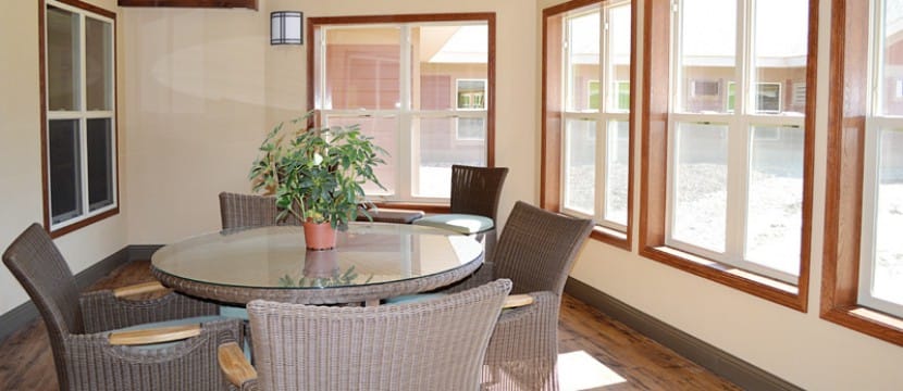 Bright interior common area with a round table and chairs