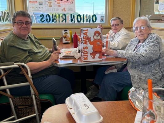 Residents enjoying a meal together in a dining area