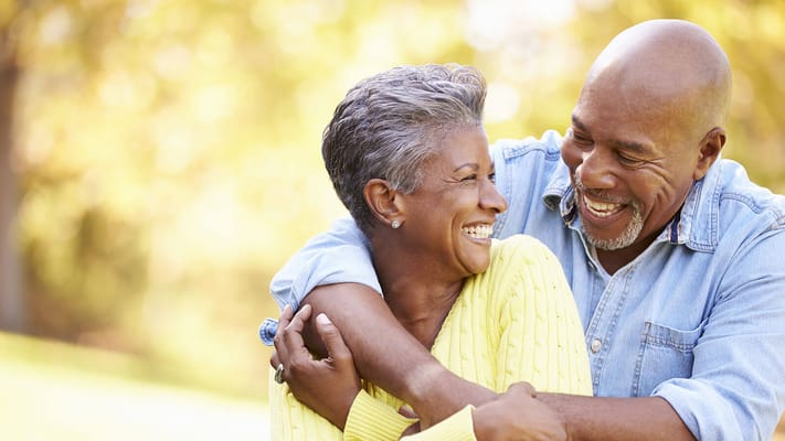 Happy couple enjoying a moment in a sunny outdoor setting
