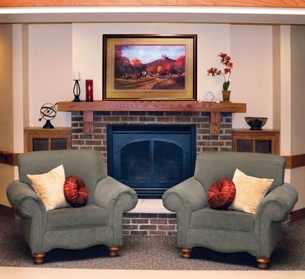 Cozy seating area with artwork above the fireplace