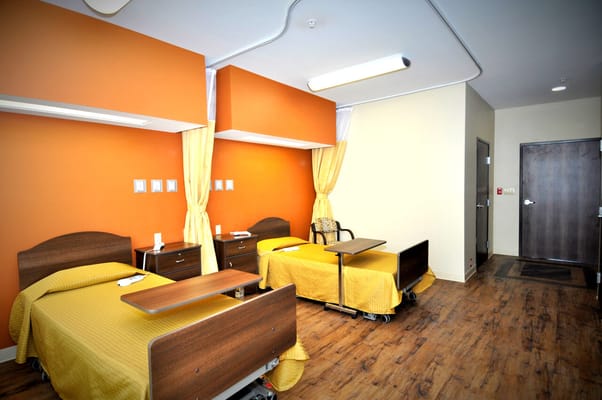 Two resident rooms with beds and bright decor