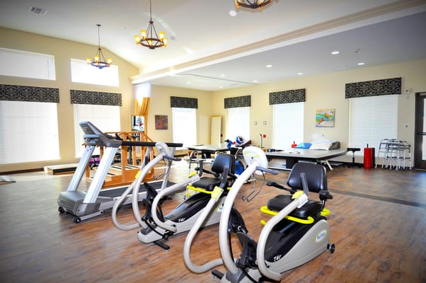 Fitness area with exercise machines and natural light