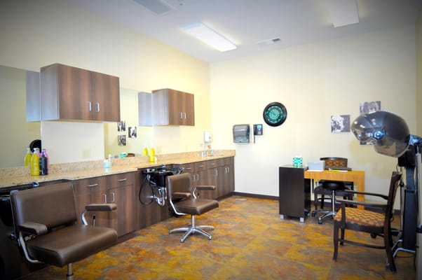 Hair salon with styling chairs and mirrors