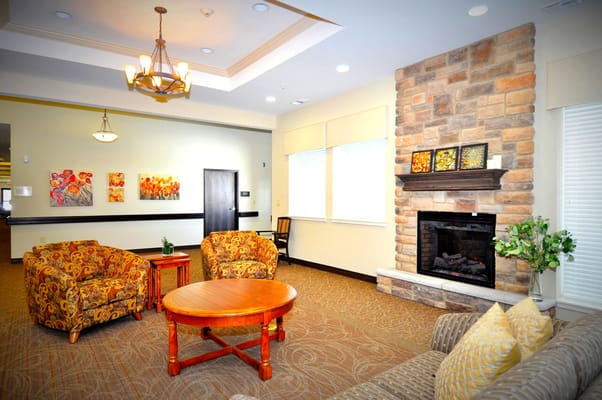 Cozy common area with comfortable seating and artwork