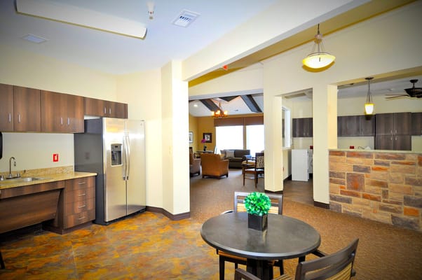 Bright common area with kitchen and seating