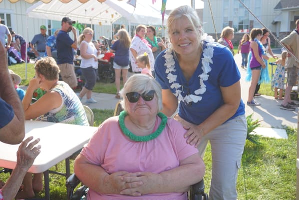 Residents and staff at an outdoor event with decorations