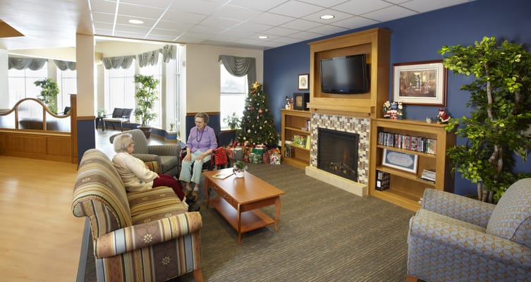 Residents enjoying conversation in a cozy common area