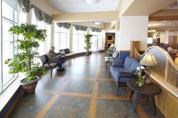 Bright interior of a lounge area with a resident