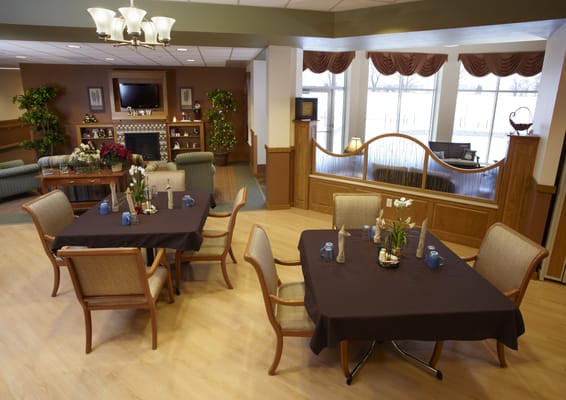 Bright dining area with tables and chairs