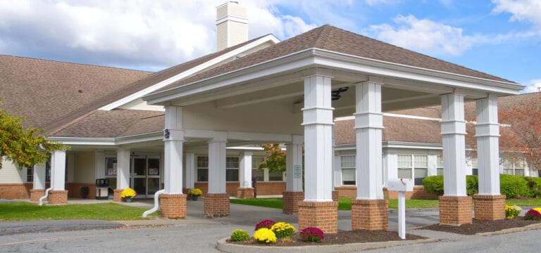 Entrance of a senior living facility with covered walkway