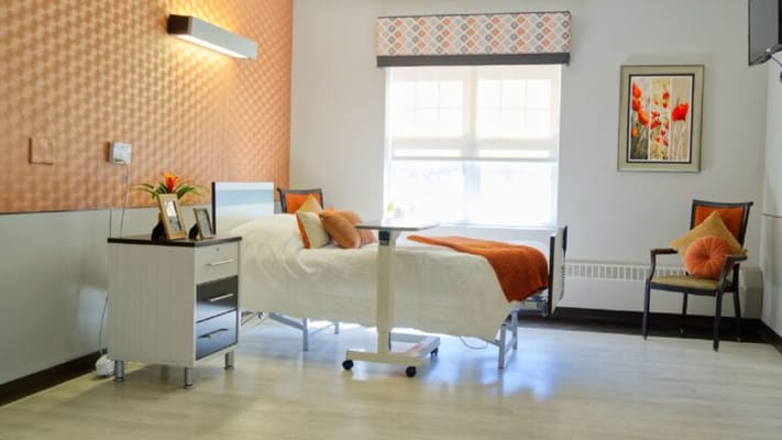 Cozy resident room with a hospital bed and daylight