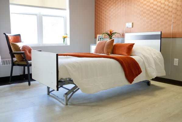 Cozy resident room with bed and seating area