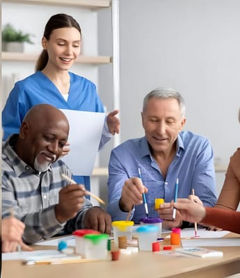 Residents and staff engaged in an art activity