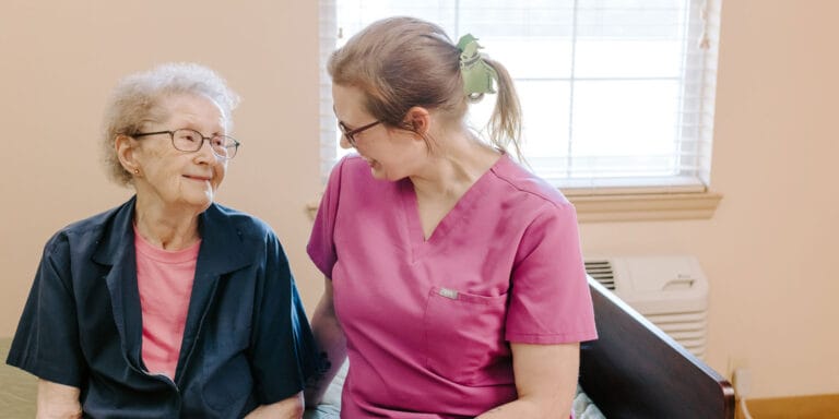 Care staff and resident sharing a moment