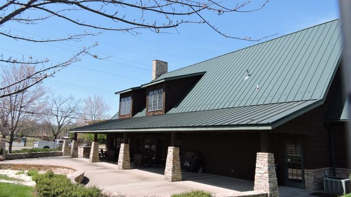 Exterior view of a senior living facility with green roof