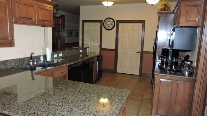 Bright kitchen area with wooden cabinets