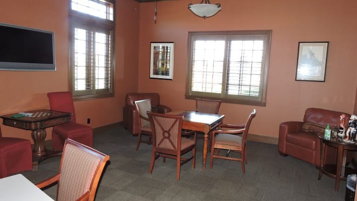 Cozy lounge area with comfortable seating and artwork