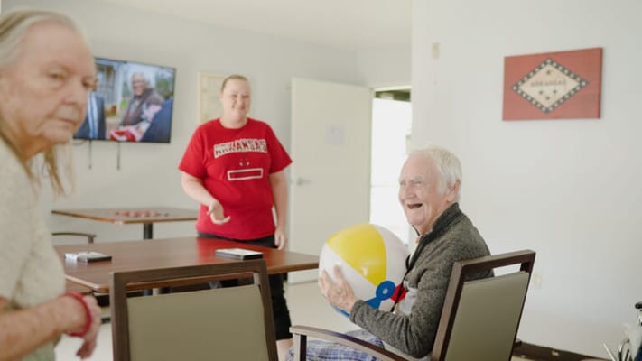 Residents engaging in a fun activity with a beach ball