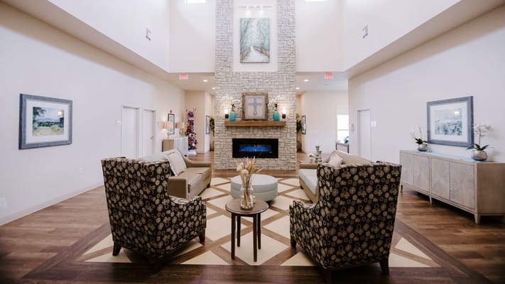 Bright interior lounge area with seating and decor
