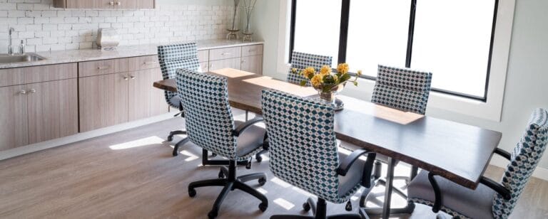Modern dining area with a large table and chairs