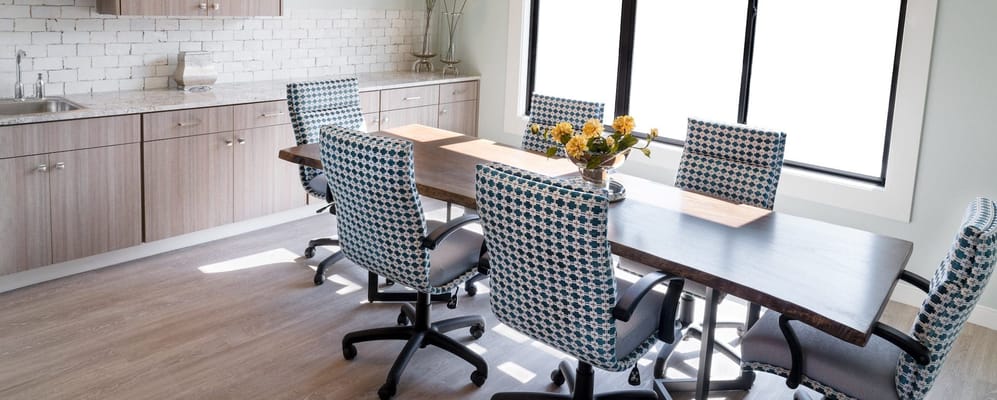Modern dining area with a large table and chairs
