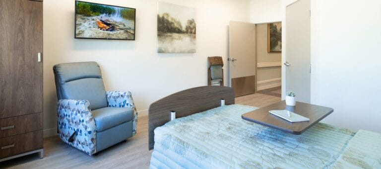 Cozy resident room with a bed and chair