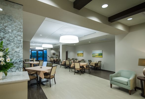 Bright dining area with tables and chairs