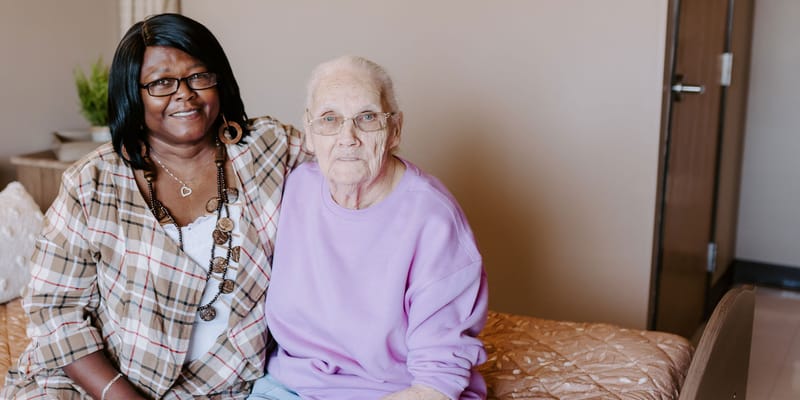 Staff member with resident in a cozy room