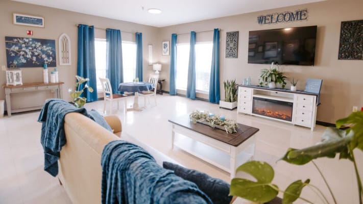 Bright and inviting lounge area with seating and decor