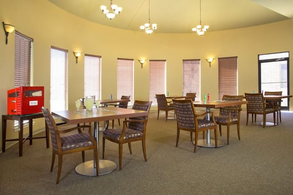 Dining area with tables and chairs in a common space