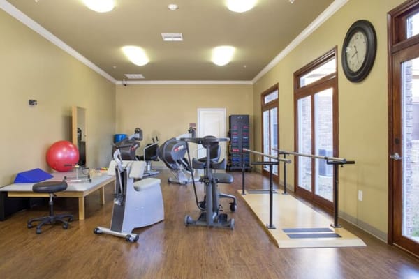 Physical therapy room with exercise equipment