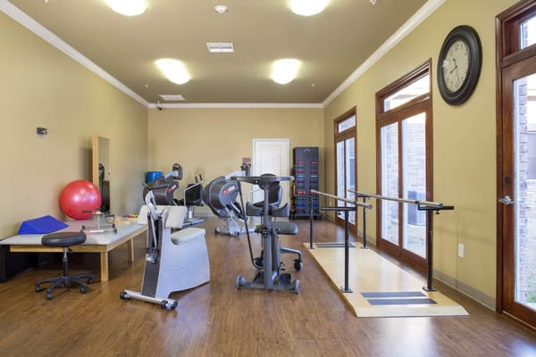 Physical therapy room with exercise equipment