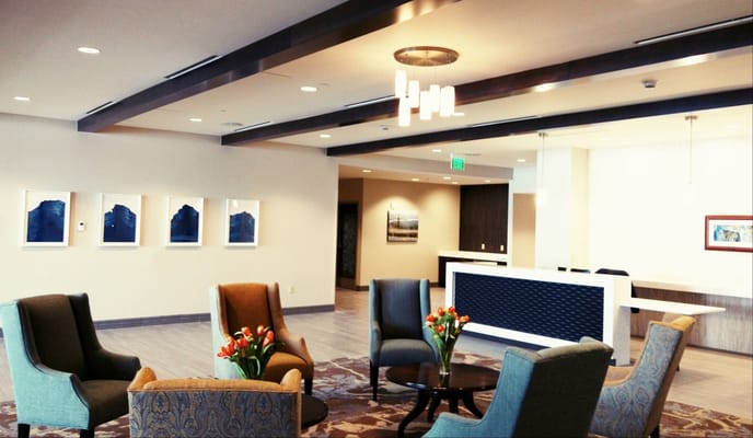 Bright common area with seating and artwork