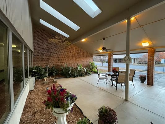 Covered outdoor seating area with plants