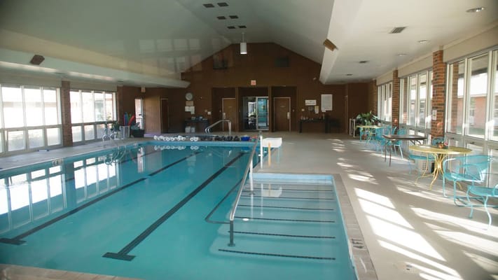 Indoor swimming pool with lounge seating