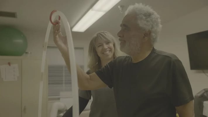 A resident and staff member engaged in an activity