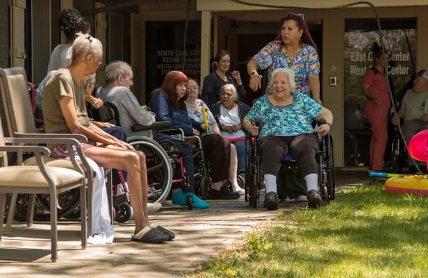 Residents enjoying activities in a serene outdoor space