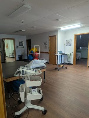 Interior view of a therapy room with exercise equipment