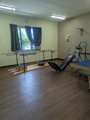 Interior room with rehabilitation equipment and natural light