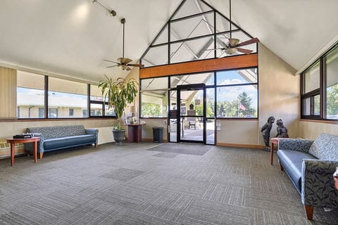 Bright lobby area with seating and natural light