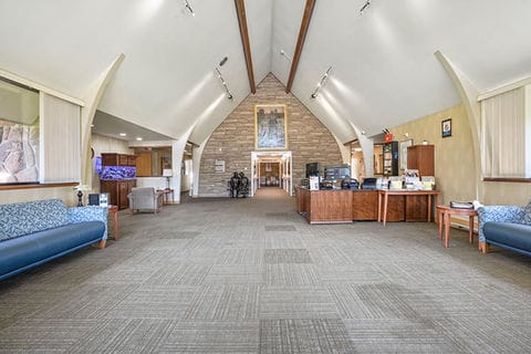 Bright common area with seating and decorative features