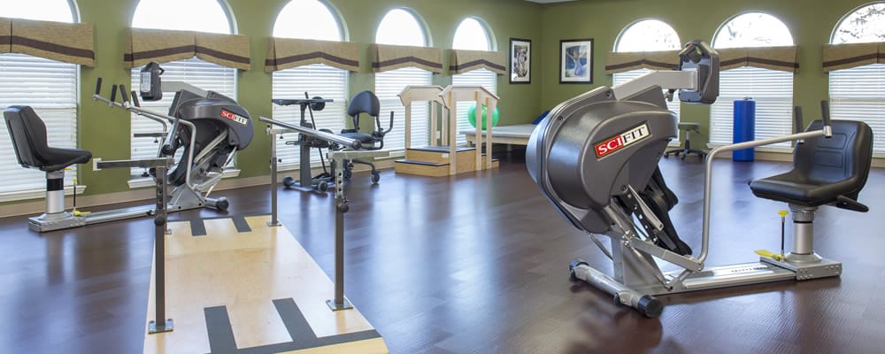 Fitness equipment in a well-lit exercise room