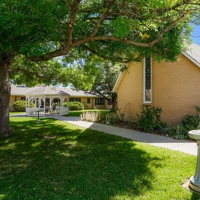 Well-maintained garden area with gazebo and pathway