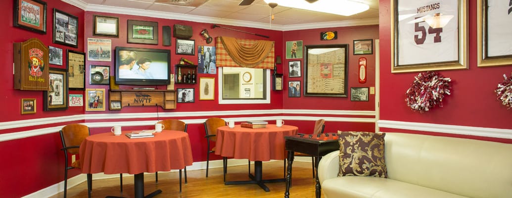 Cozy common area with red walls and historical decor