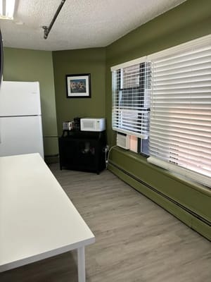 Bright interior kitchen area with appliances