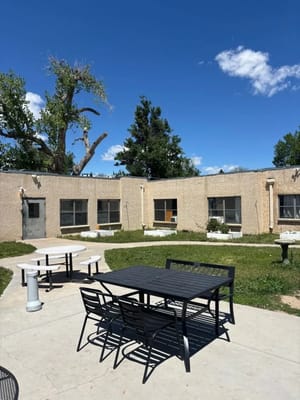 Outdoor seating area with tables and chairs