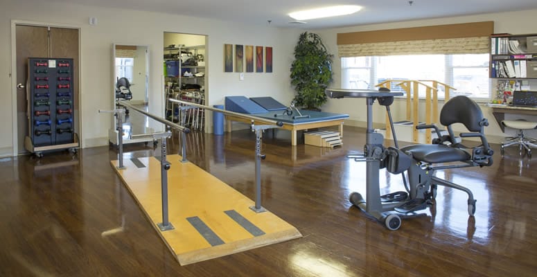 Physical therapy room with equipment and open space